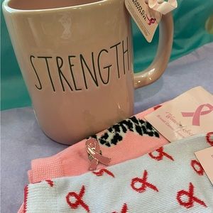 Rae Dunn breast cancer STRENGTH mug w/the pink ribbon. Incl 2 pr socks and pin.